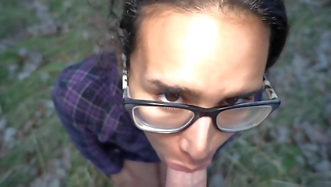 Brunette teen girl in a park gets caught with her boyfriend