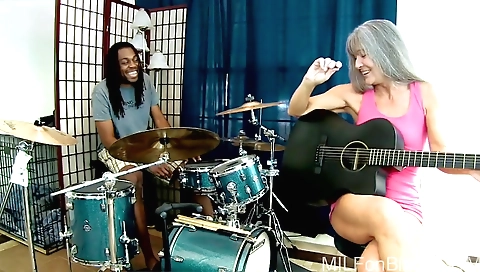 Interracial mature blonde in black pants and stockings