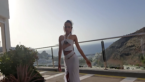 Asian teen dancing in sexy costumes in public balcony