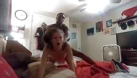 Amateur brunette is getting her pussy fucked by a white dick