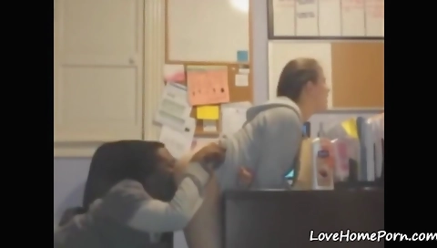 Amateur brunette in office doing a dirty interracial blowjob