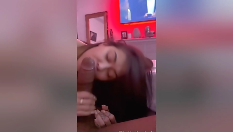 Tattooed up brunette gets a handjob on her hairy cock